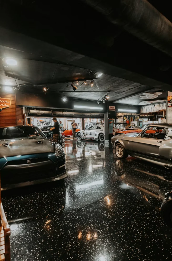 Luxury automotive showroom with dark flake floor